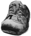 Shoe on top of garbage pile