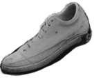 Shoe on top of garbage pile