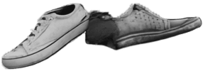 Shoe on top of garbage pile